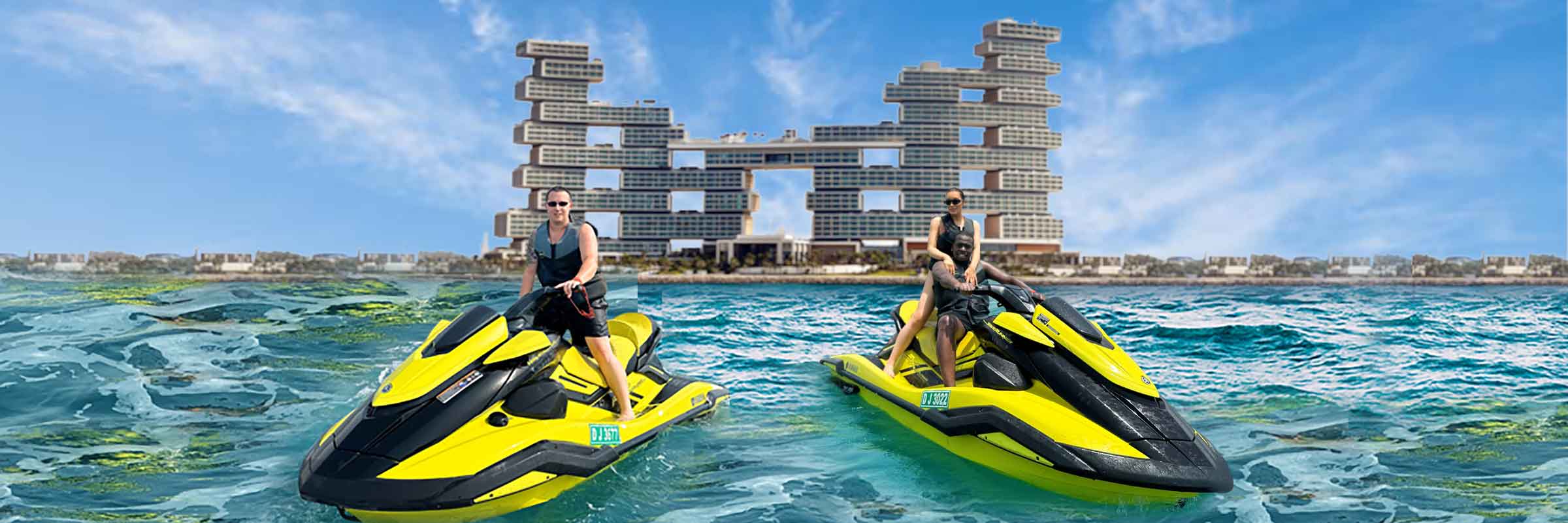 Tourist on a Jet Ski posing for a picture with Royal Atlantis backdrop