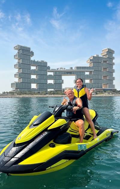 Couple Posing on Xtreme Jet Ski with Royal Atlantis Backdrop