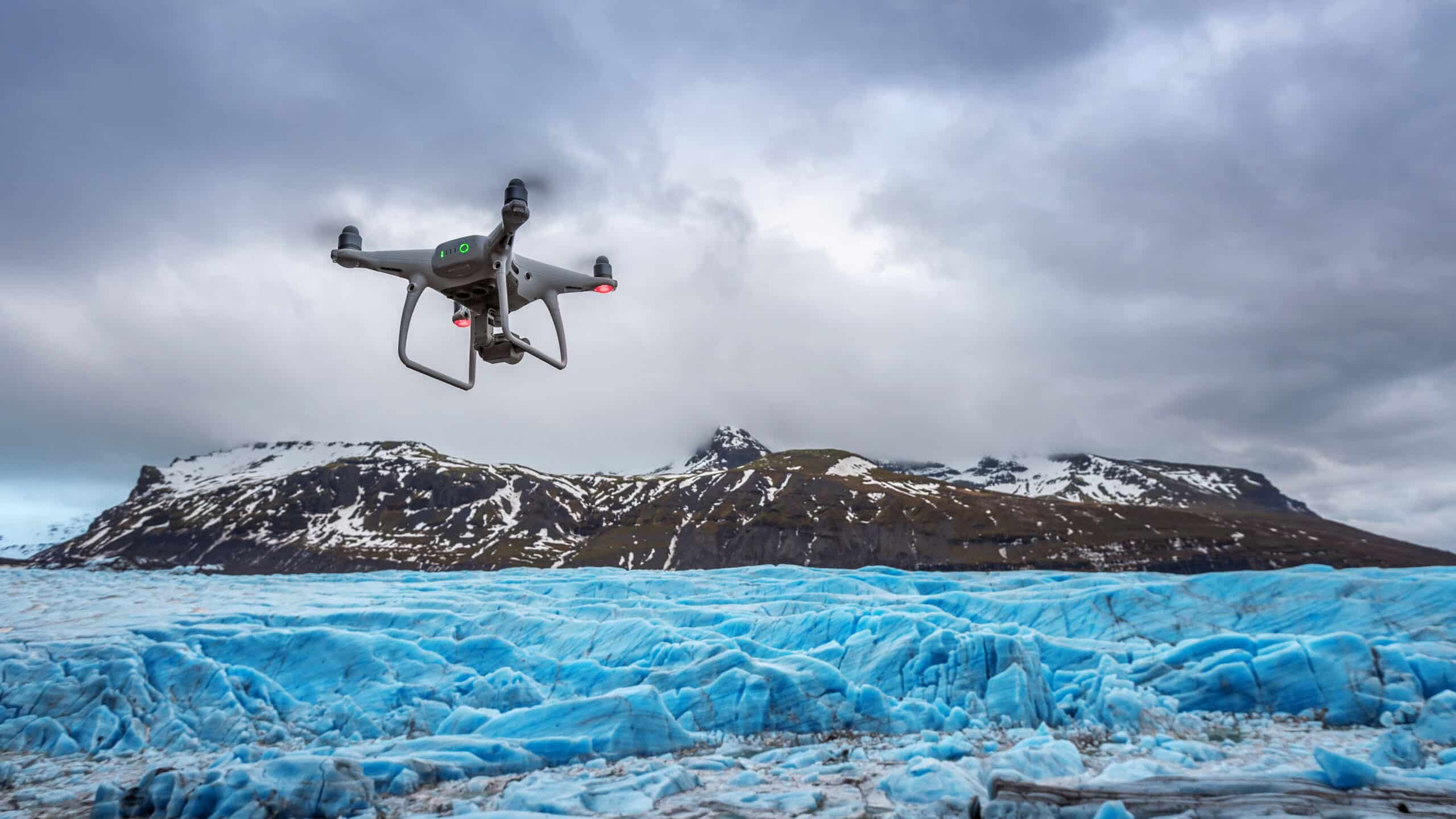 DIJI-Osmo Drone with a camera is flying on iceberg