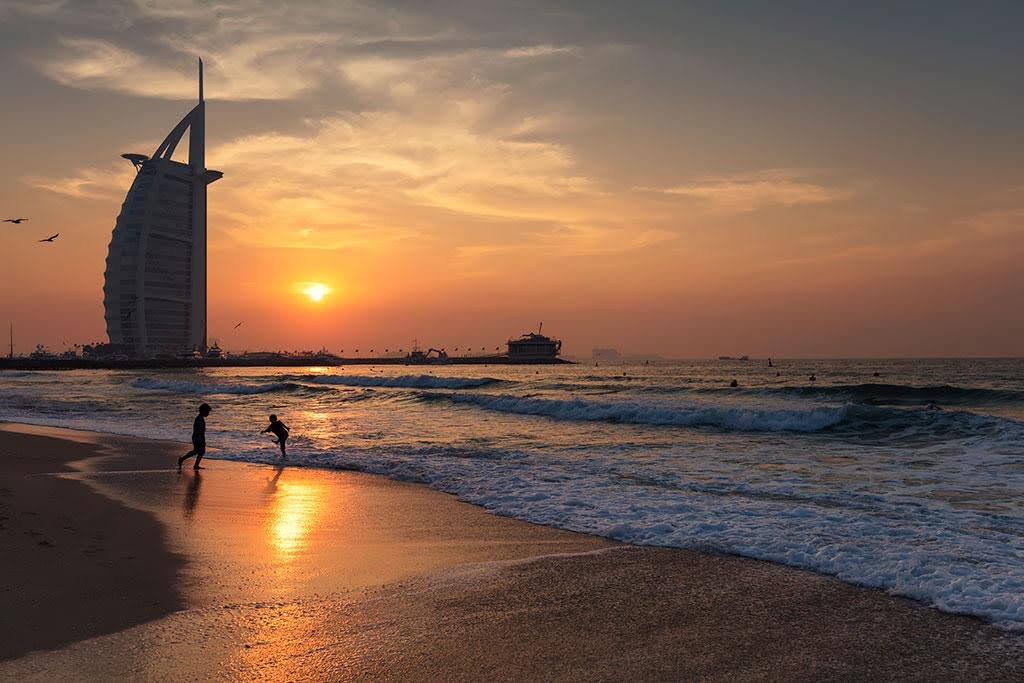 beautiful Burj Al Arab silhoutte shot from sunset beach