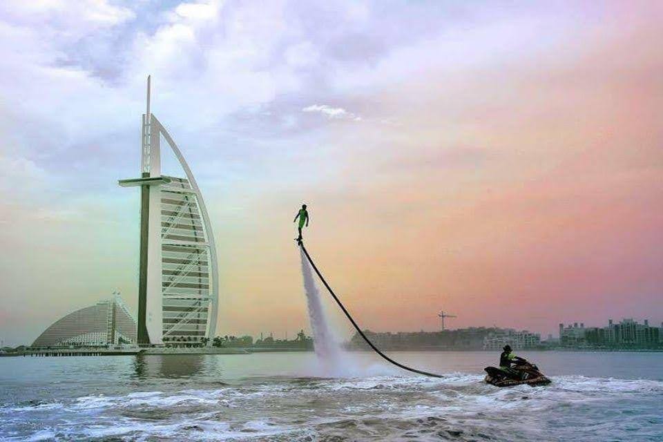 Person Flyboarding with Burj al Arab in the back.
