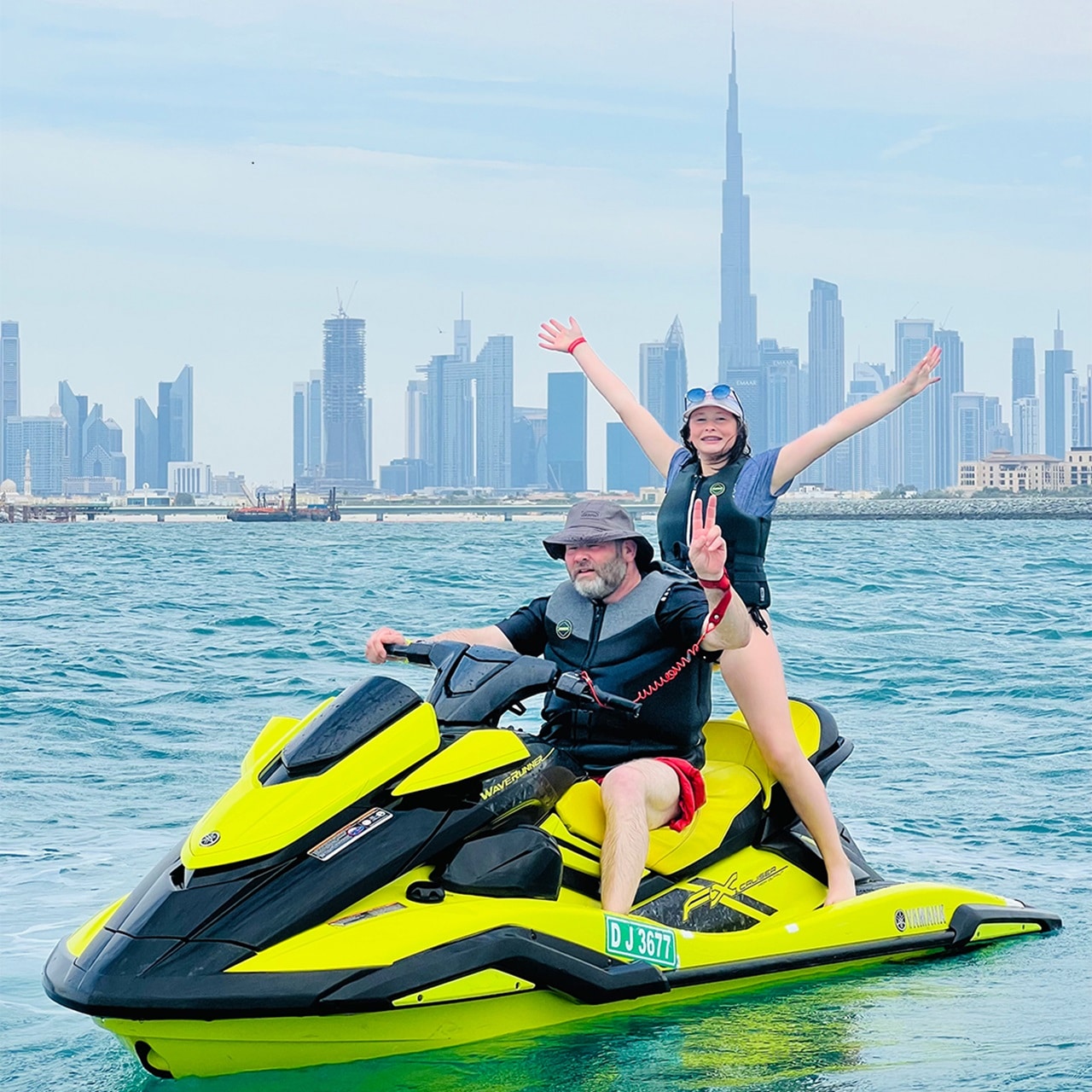 Xtreme Jet Ski Customers Posing for Picture with Dubai Skyline in Background